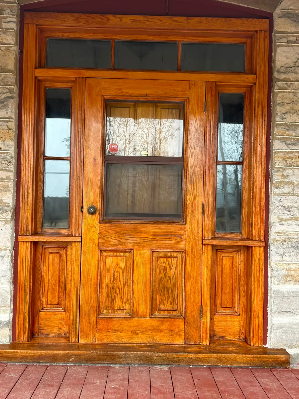 Refinished heritage wood front door with sidelights
