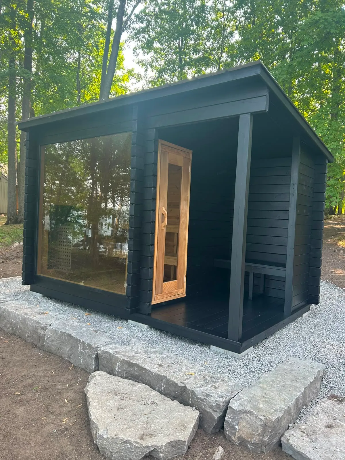 Modern sauna cabin stained dramatic black